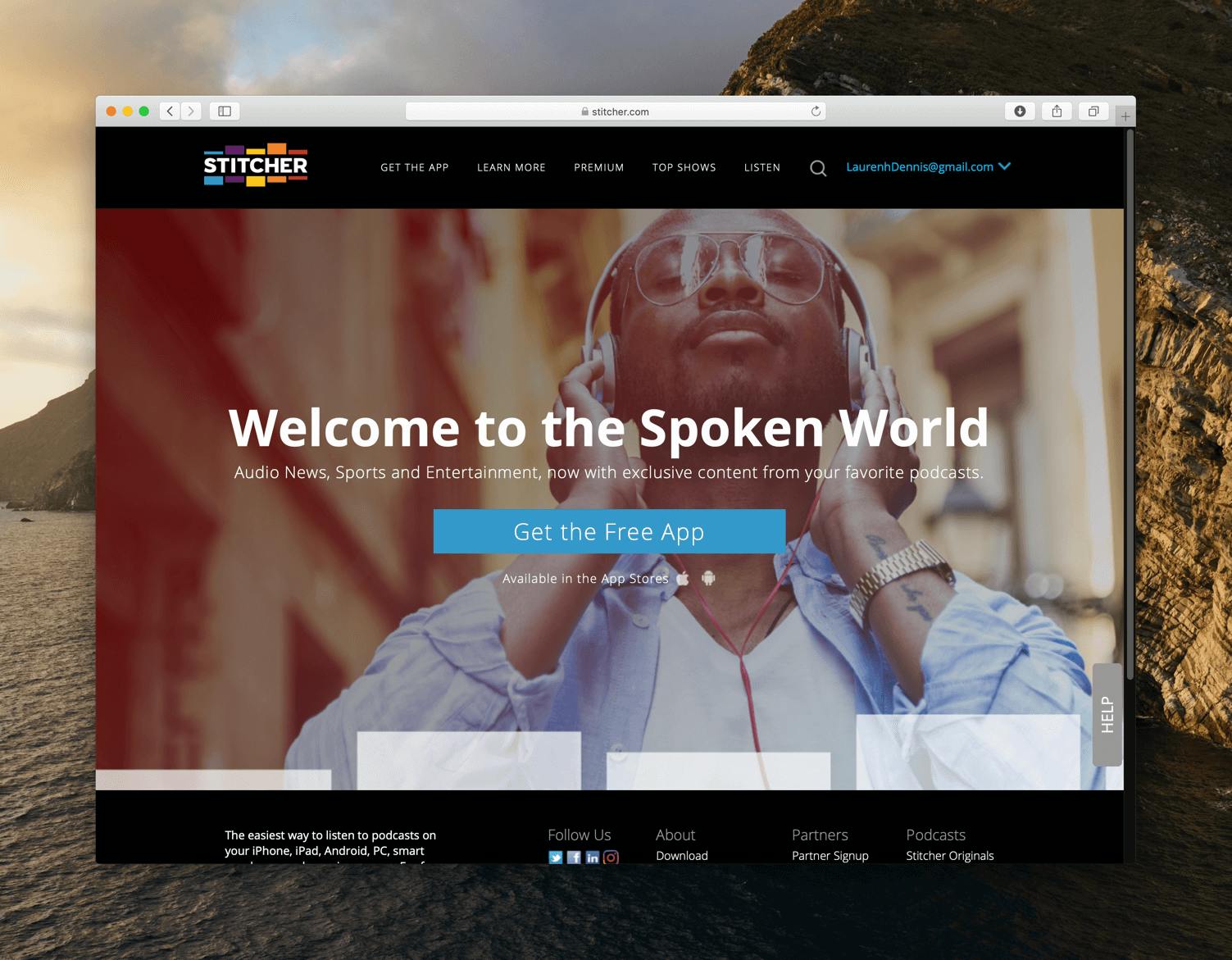 Stitcher's homepage. A man with headphones on and a link to download the podcast player app